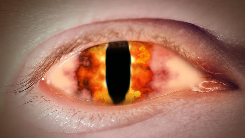Close up to devil's fire eyeball. Loop.