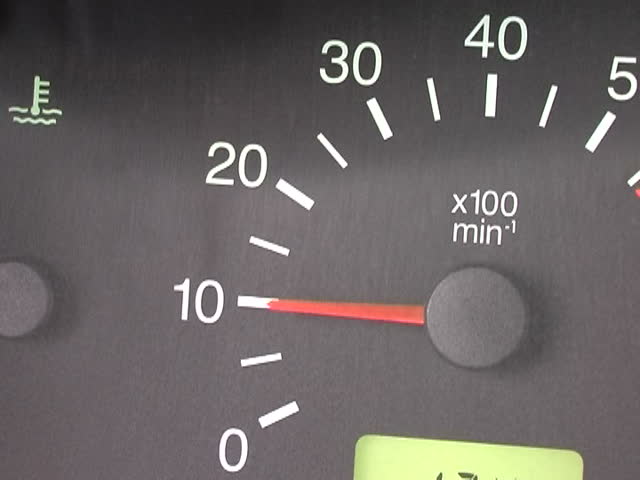 Speed (closeup of tachometer in car)