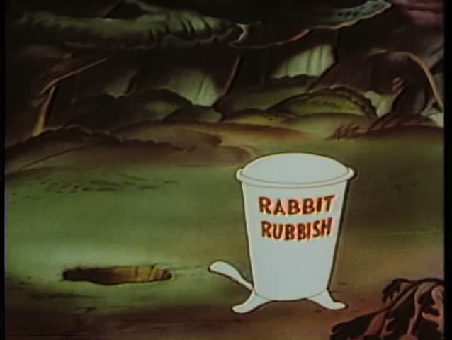 Cartoon of rabbit throwing rubbish out of a hole and into a trash can