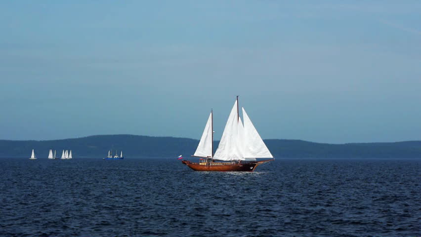Sailboat in regatta on blue sea