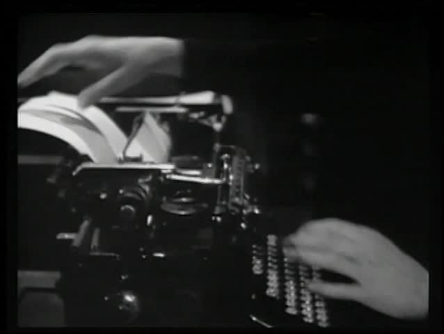 Frustrated writer crumpling page from typewriter and throwing in garbage