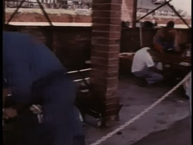 Mechanics preparing cars for race