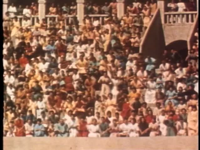 Wide shot of audience in amphitheater
