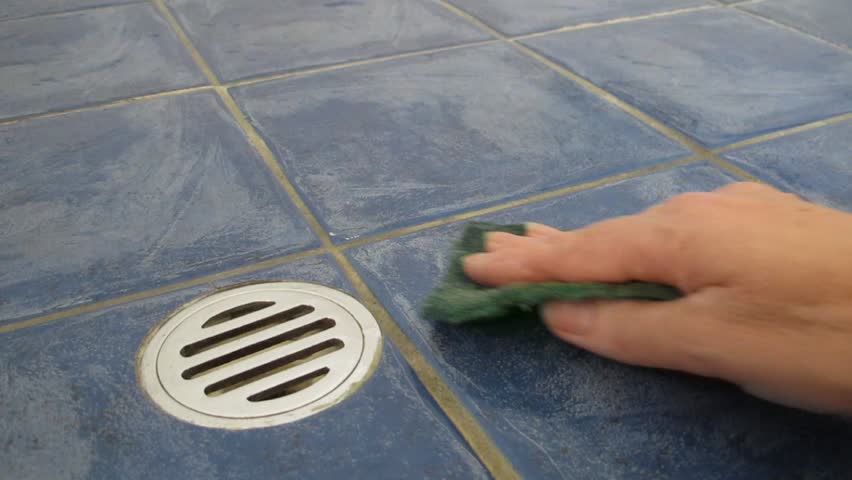 Cleaning floor tiles in shower