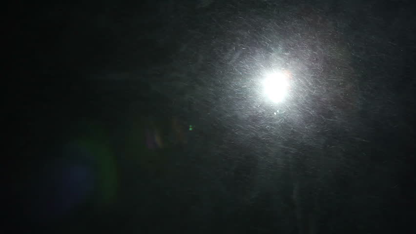 Blizzard illuminated by lights