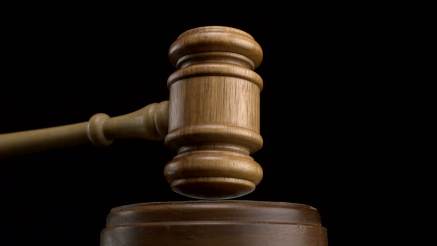 Gavel pounded on block