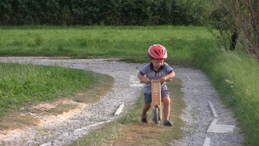 Boys on wooden bicycles, collision