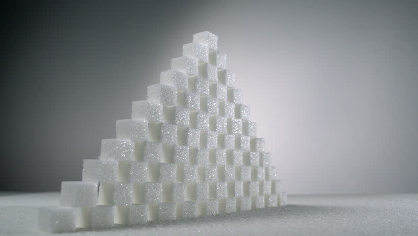 Slo-motion stack of sugar cubes falls
