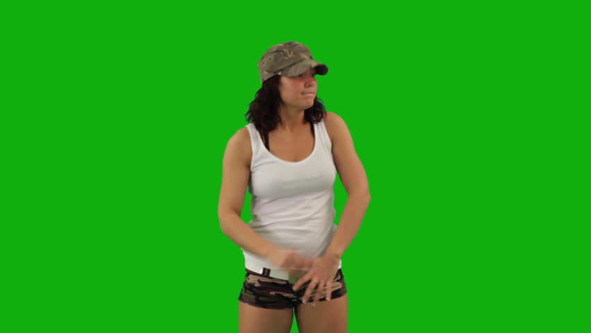 Military girl dancing hip-hop against green screen 