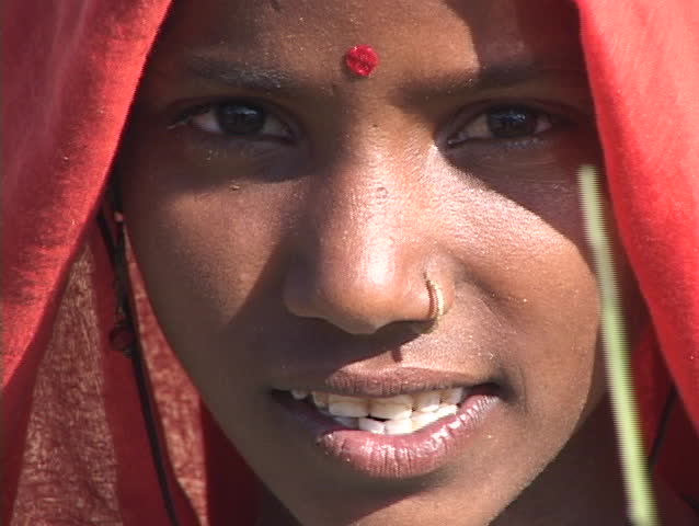 An Indian peasant woman chants.