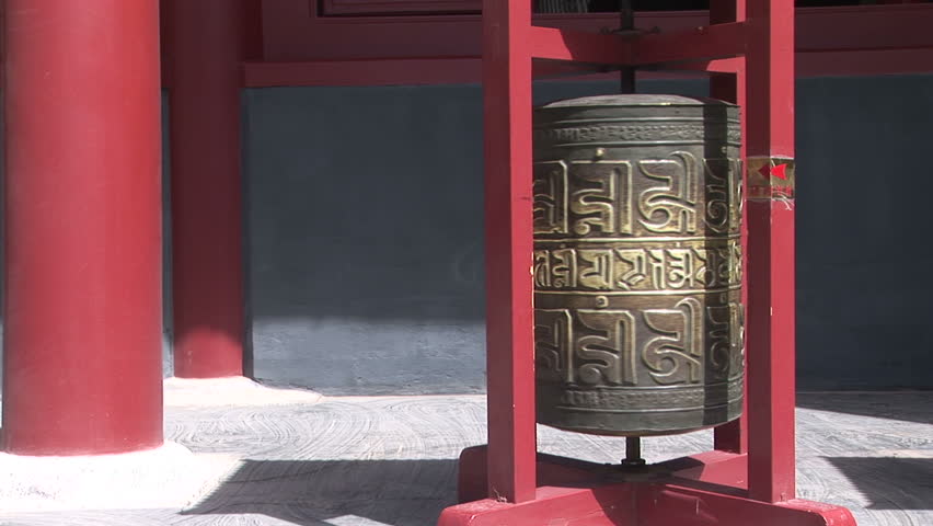 Bronze prayer wheel spinning in the Lama Temple, Beijing, China