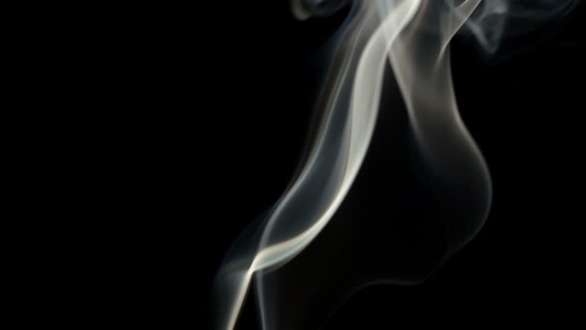Real incense on black background