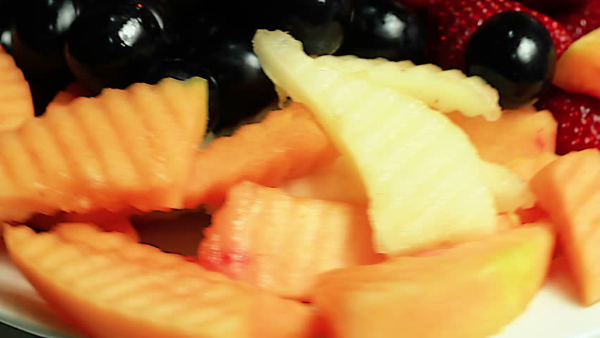 Close-up of a rotating fresh fruit plate. Loopable.
