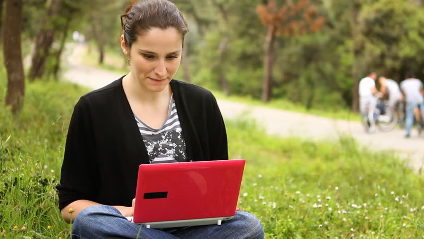 beautiful girl using computer in countryside, phaeton passing behind 2