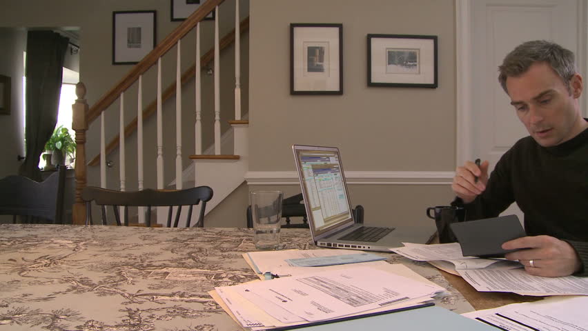 Man working on bills and finances