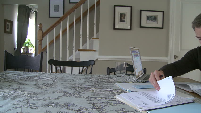 Man working on bills and finances