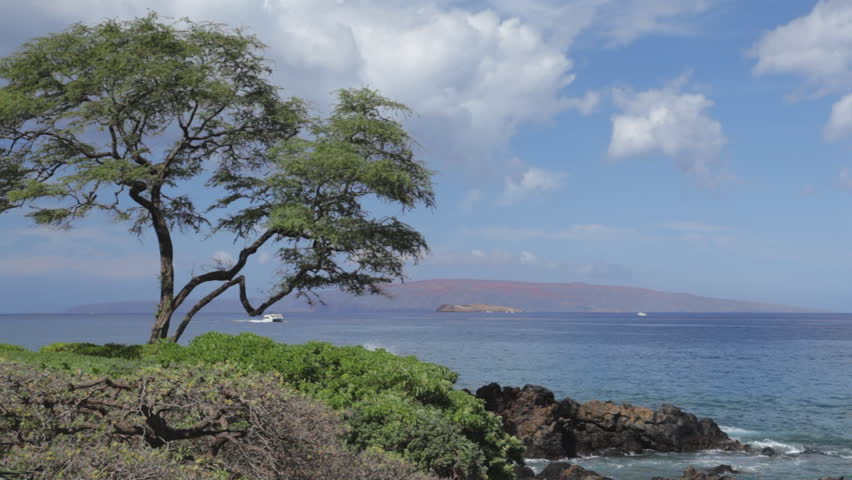 Kahoolawe (with Molokini visible in front of it) as seen from South Maui, Hawaii.