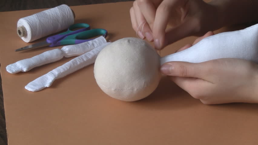 Girl stitching cloth toy doll