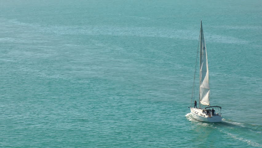 sailboat heading towards the sea