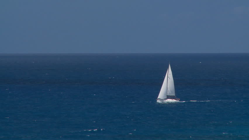lonely sailing boat in the ocean