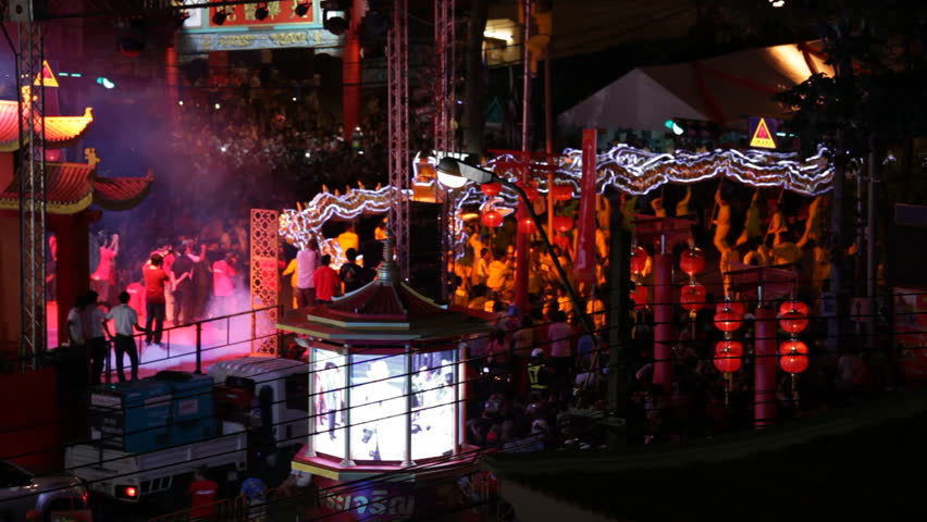 THAILAND - JANUARY 24: Thai crowd is attending the Chinese New Year celebrations with a dragon show on January 24, 2012 in Chinatown of Bangkok, Thailand