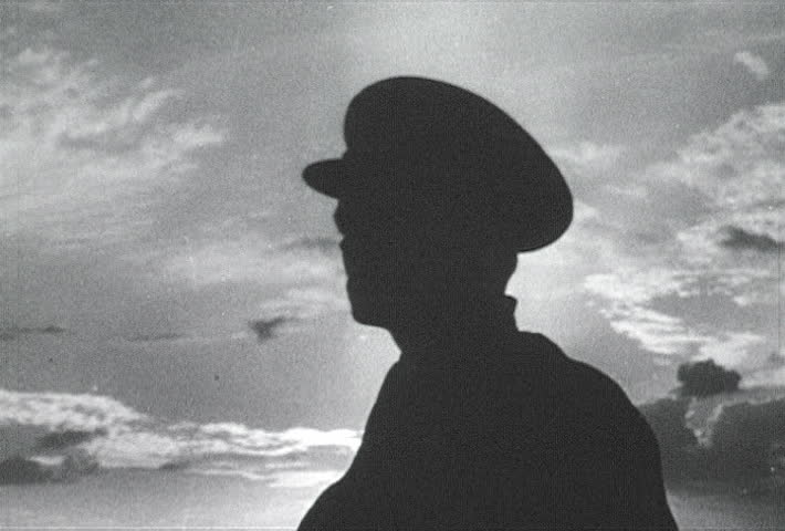 ATLANTIC OCEAN - CIRCA 1942-1944: World War II, Sailor Scanning The Horizon With Binoculars, publisher National Broadcasting Service (U.S.)
