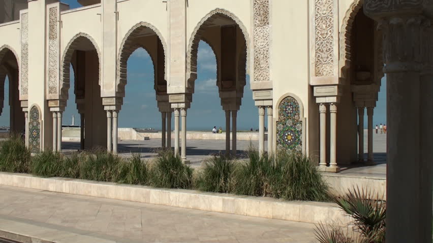 Some tourists walk on the external gardens of Hassan II Mosque on March 12 2011