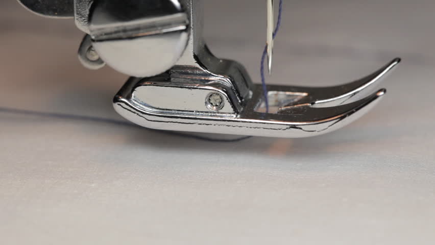 Close up on a sewing machine showing process