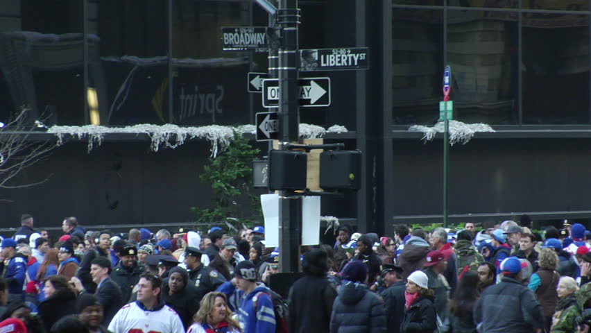 NEW YORK - FEBRUARY 7: Parade-goers scatter after the ticker-tape parade in honor of the Super Bowl Champions New York Giants on February 7, 2011 in New York. 