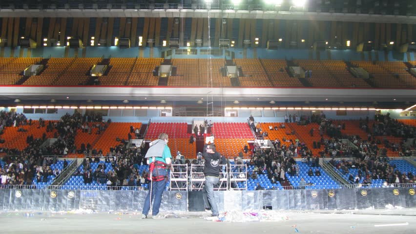 MOSCOW - DEC 17: (Timelapse View) Working scenes go on down rope ladder from above, concert of Legend RetroFM in Sports complex Olimpiyskiy, on Dec 17, 2011 in Moscow, Russia  