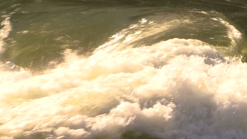 Raging river water cascading down into a torrent making