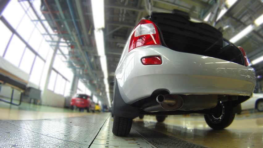 New car moves on pipeline on automobile factory, time lapse