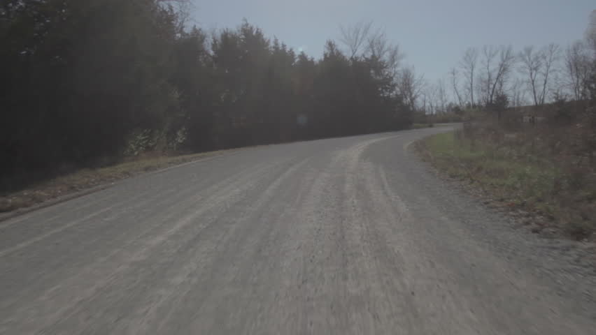Driving on a Bumpy Winding Country Road