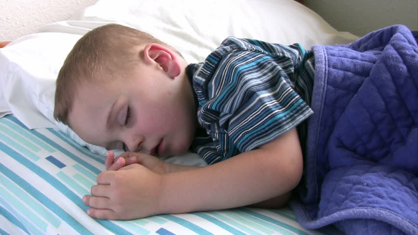 Boy sleeping in his bed.  HD 1080i