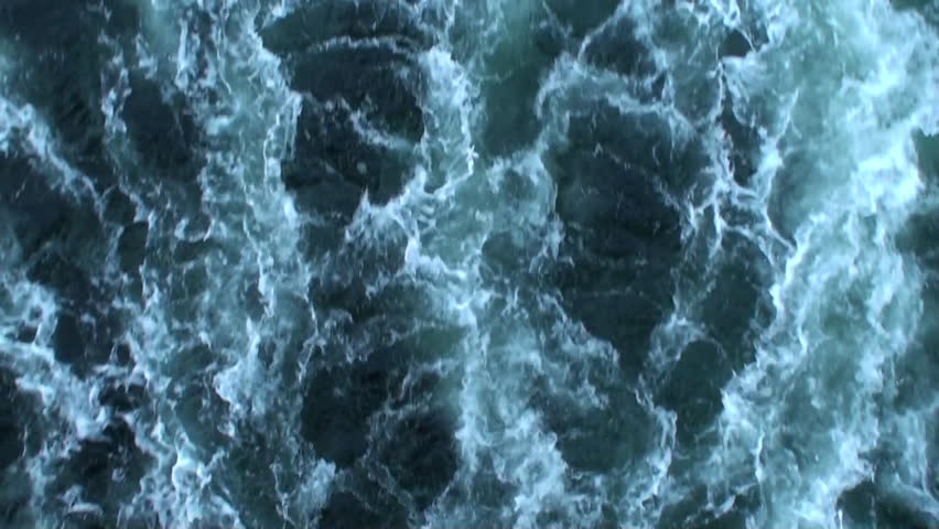 Water foaming behind a boat
