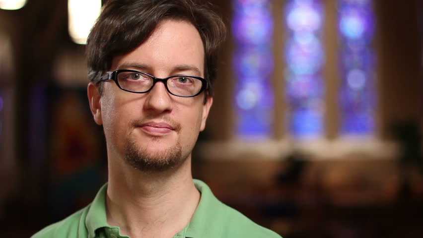 Man at church, looking at camera