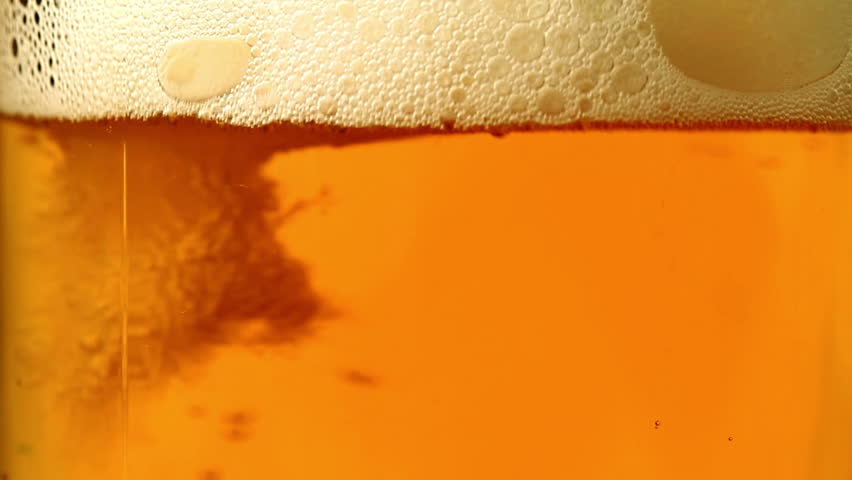 Beer is poured in a glass.
