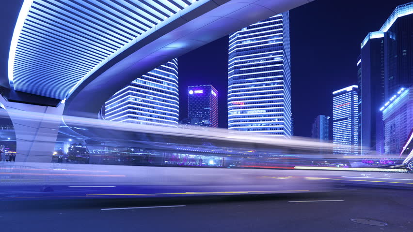 Time-Lapse, city traffic on the modern building background in Shanghai Pudong, China.