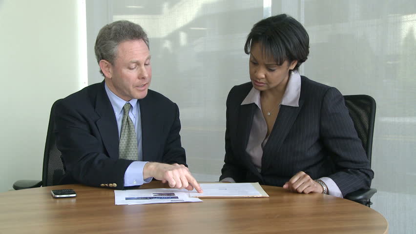 Co-workers discuss presentation (4 of 7)