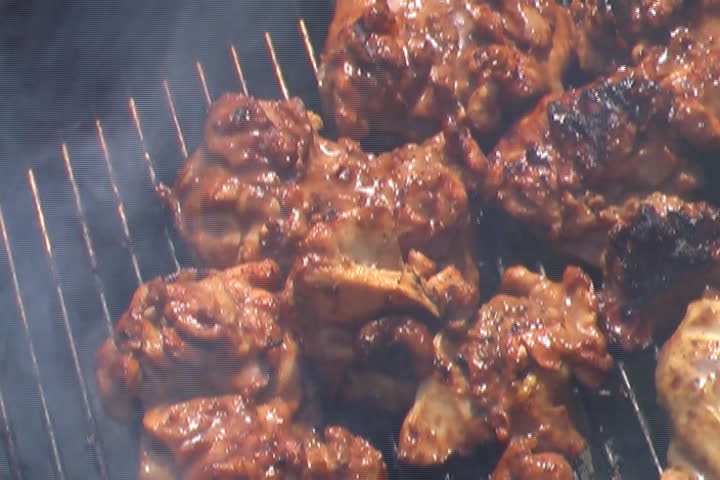 Zoom Out on some chicken thighs on a barbecue grill - 16:9 anamorph