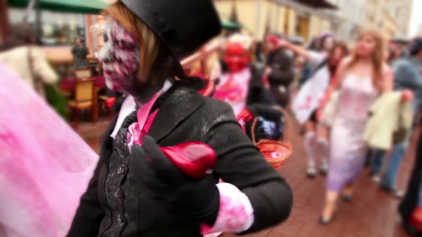 Bloody zombies crowd walk include newlyweds and bridesmaid