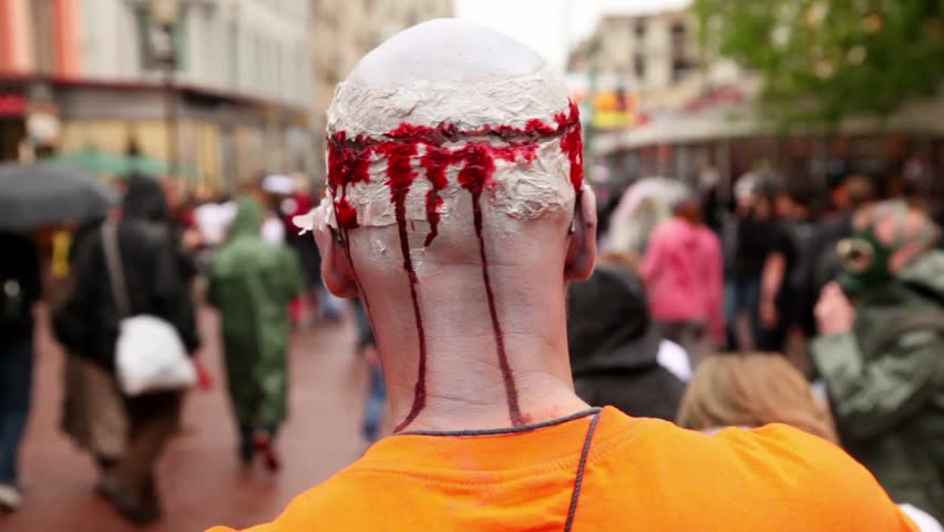 MOSCOW - MAY 14: Zombie Parade by street with bloody head after trepanation of skull during Zombie Parade on May 13, 2011 in Moscow, Russia.