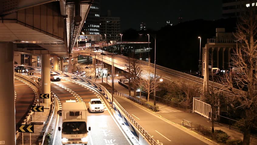 Metropolitan highway with cars at night in Tokyo, Japan