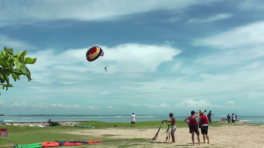 BALI, INDONESIA - CIRCA JANUARY 2012: Parasailing on Bali beach, teachers and learners, circa January 2011 in Bali, Indonesia.