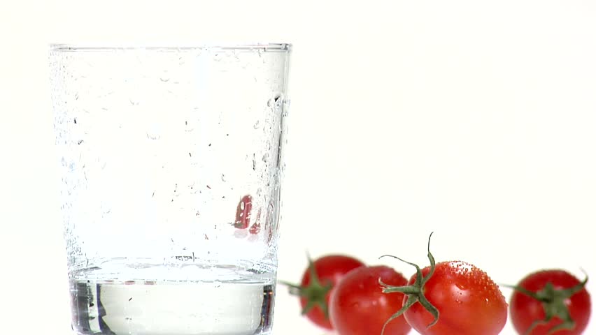 Pouring tomato juice into a chilled glass