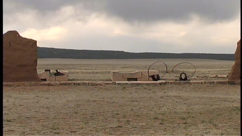 A smooth pan from left to right of the Wagon Shop on the grounds of old Fort Union National Monument in central New Mexico, with wagon wheels and adobe walls.