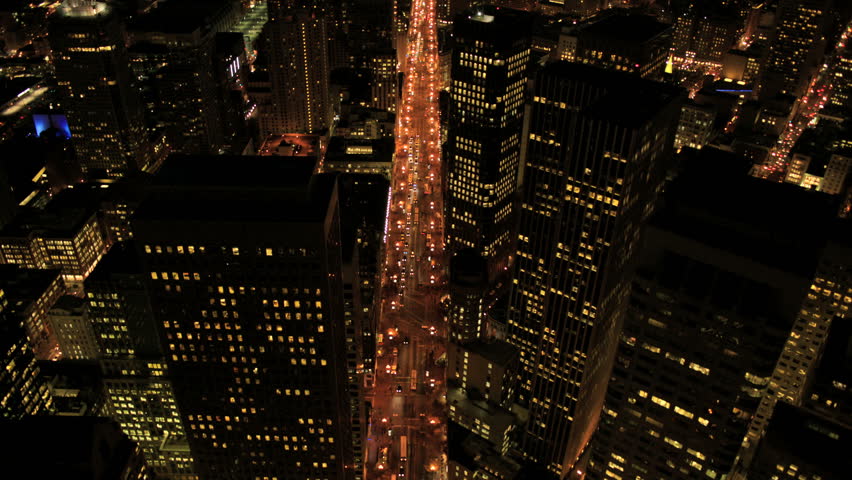 Aerial night illuminated view of skyscrapers, rooftops and city streets, San Francisco North America, USA