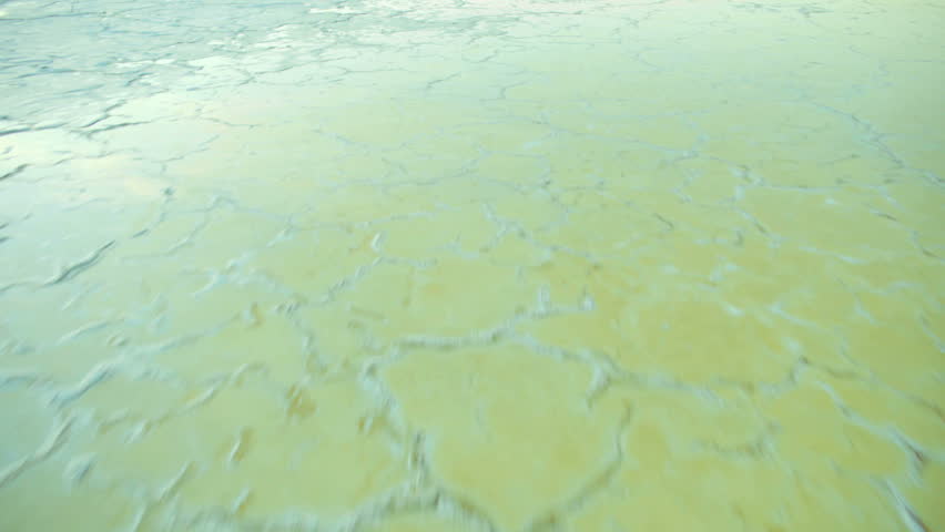 Aerial low level view of the crusted salt forming on the restored ponds