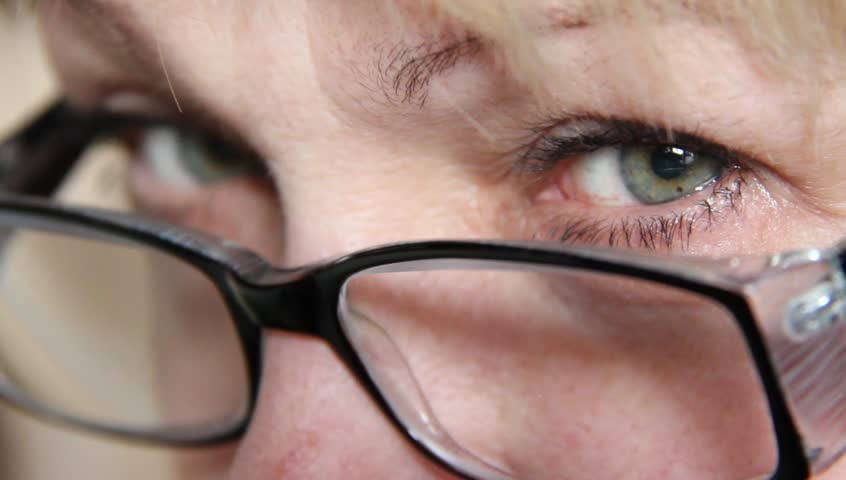 Woman wearing glasses looking into camera