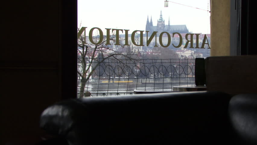 LONG SHOT, View on St Vitus's Cathedral and trams trough window in Prague, Czech Republic